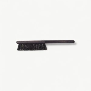 Professional Rodeo fade brush in L format for clearing loose hair and checking blend transitions.