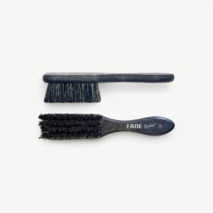 Professional Rodeo fade brush in XS format for clearing loose hair and checking blend transitions.