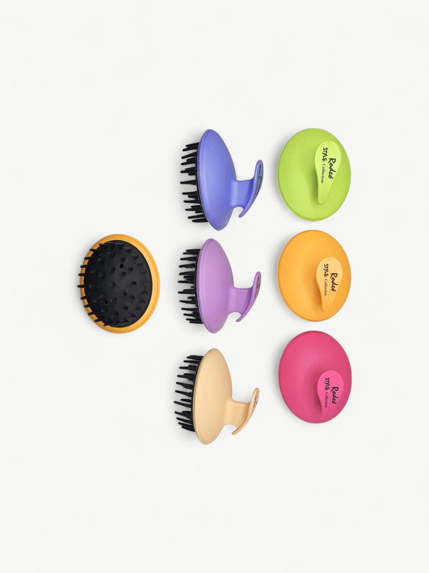 Professional hair and scalp massage brush for cleansing, detangling and stimulating massage routines.