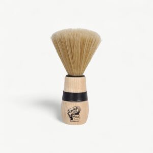 Professional neck-dusting brush for removing loose cut hair after barbering and styling services.