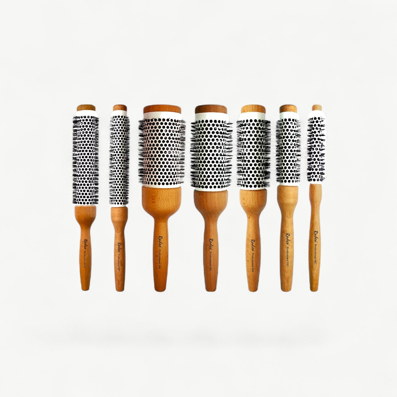 Professional 58mm ceramic radial blow-dry brush with a wooden handle for smooth, controlled styling.